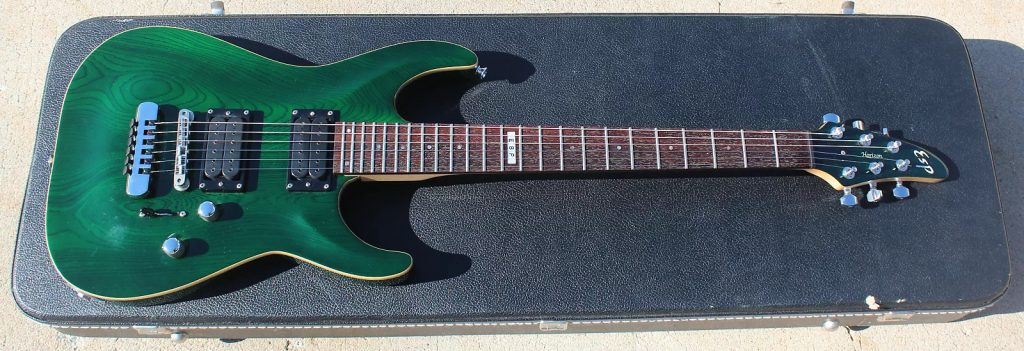 A transparent green 1996 ESP Horizon NT with Steve Vai Evolution pickups.