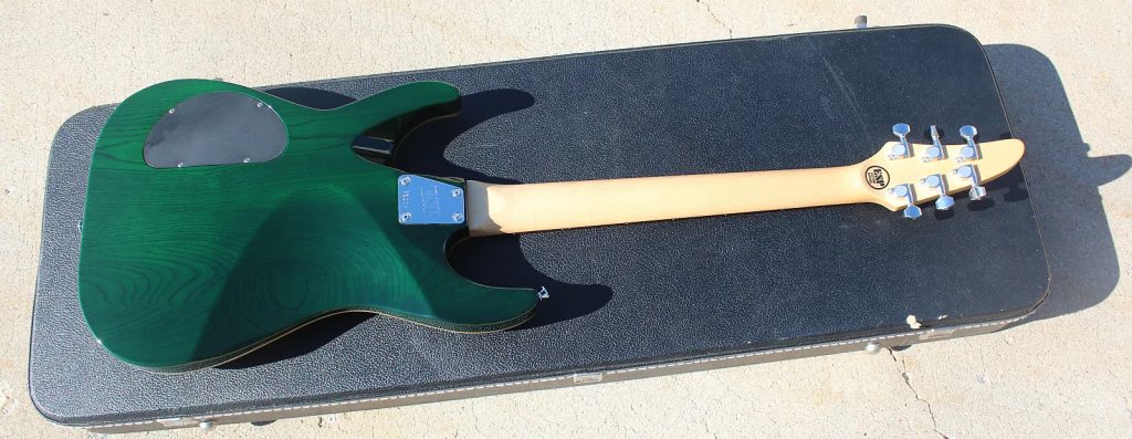The backside of a transparent green 1996 ESP Horizon NT guitar.