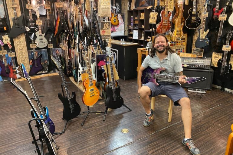 Michael Pellegrini trying out guitars at the ESP store in Tokyo
